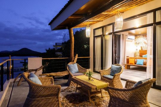 A suite terrace as the lanterns come on