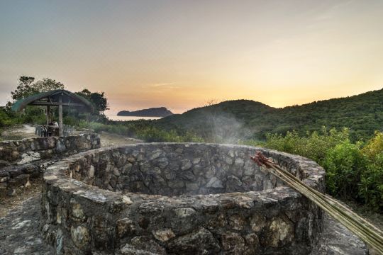 The hilltop fire pit, lit for the evening