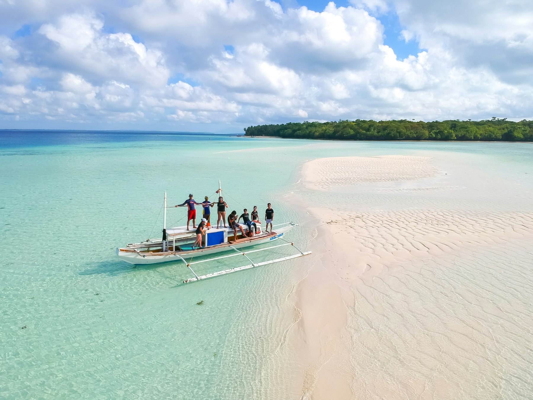 A banca resting on a sandbar